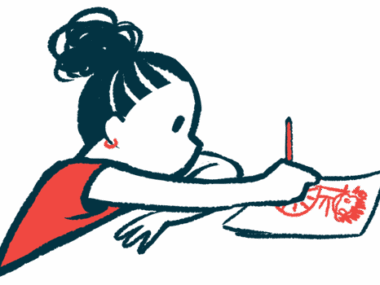 A child draws a picture while seated at a table.