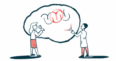 One scientist holds a flashlight up to a gigantic image of a brain while another holds up a magnifying glass.