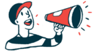 A person wearing a baseball cap speaks with a megaphone.