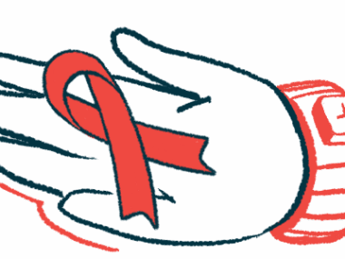 An awareness ribbon is seen on a person's palm.