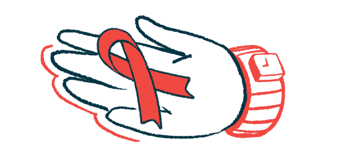 An awareness ribbon is seen on a person's palm.
